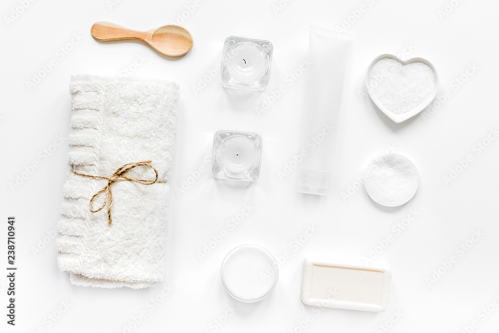 white set of cosmetics for spa on table background top view white set of cosmetics for spa on table background top view