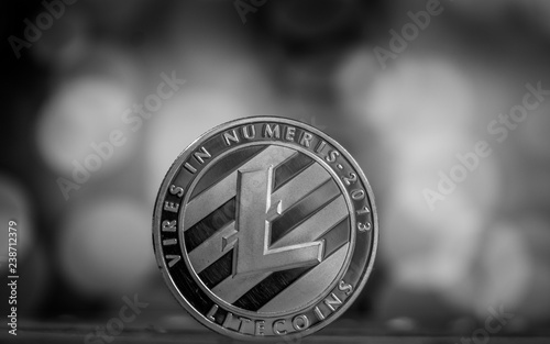 The silver litecoin. Altcoin on black table. photo