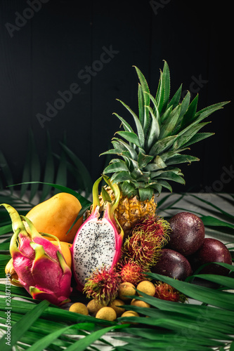 Set of exotic fruits. Assorted tropical fruits of pineapple, rambutan, passion fruit, mango, dragon fruit, longan