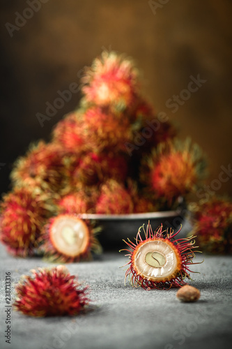Rambutan exotic fruits from tropical countries on table. Sweet translucent flesh. Healthy food with vitamin
