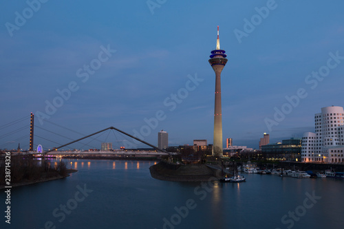 Media harbor with Rheinturm tower at night in Dusseldorf, Germany