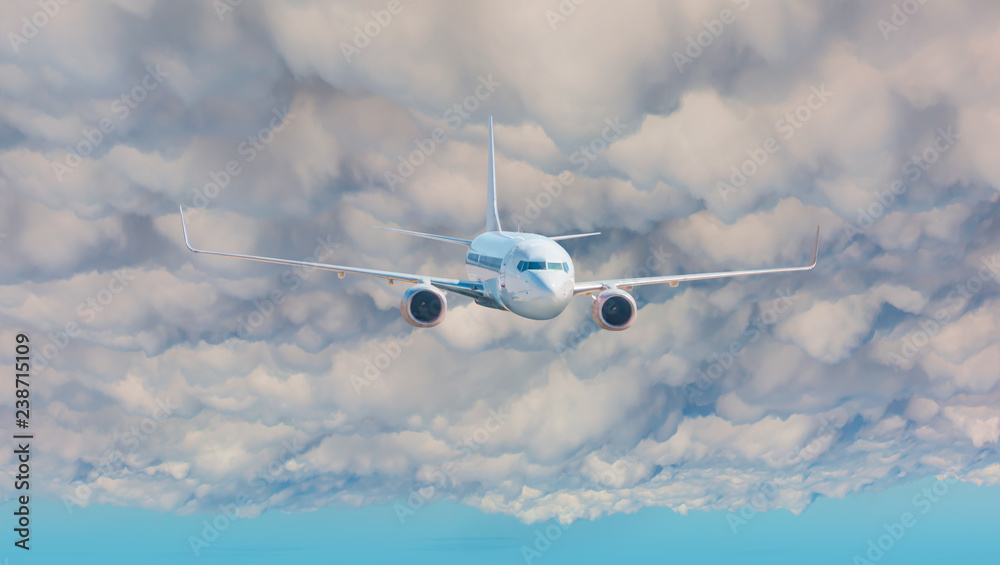 Fototapeta premium Passenger Airplane flying in the stormy dramatic clouds