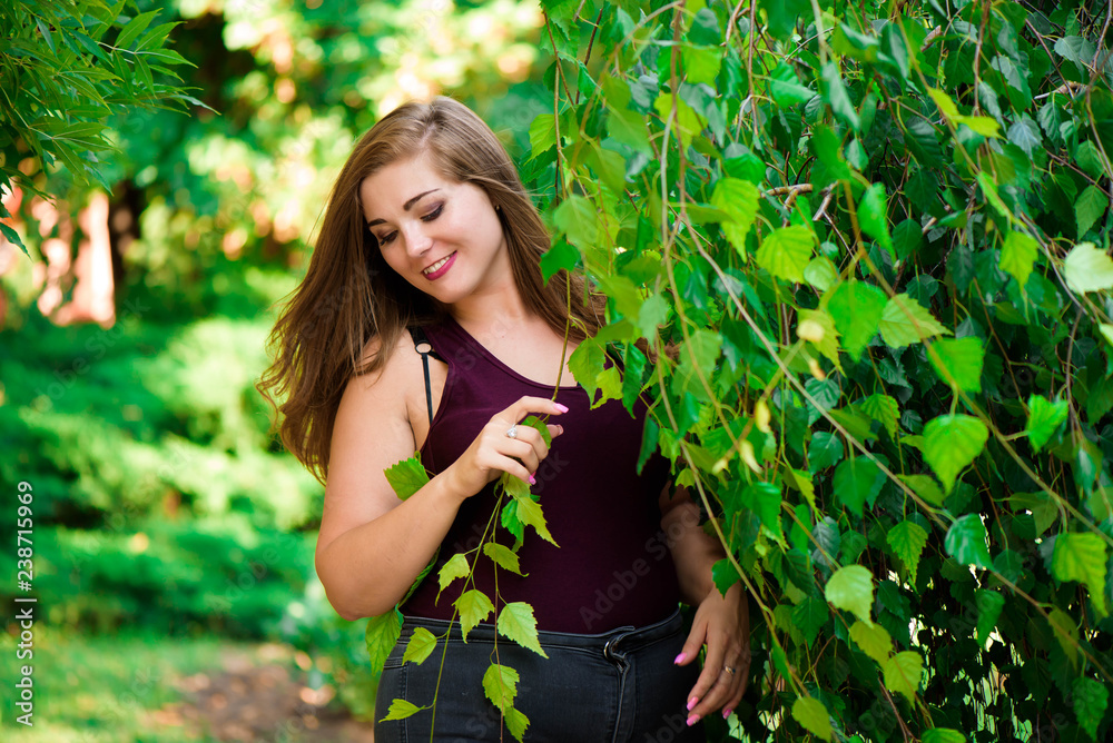 Single Young Pretty Plus Size Caucasian Happy Smiling Laughing Girl Woman, Walking In Summer Green Forest. Fun Enjoy Outdoor Summer Nature. Single Young Pretty Plus Size Caucasian Happy Smiling Laughing Girl Woman, Walking In Summer Green Forest. Fun Enjoy Outdoor Summer Nature.