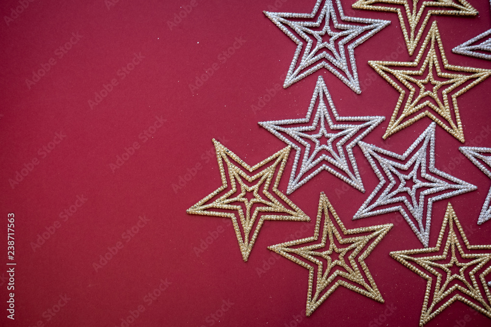 Christmas and New Year holidays background. Stars on red background