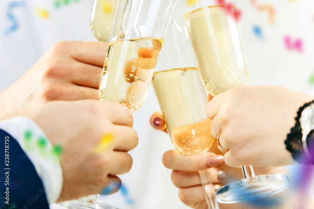 Celebration. Hands holding the glasses of champagne and wine making a toast. The party, celebration, alcohol, lifestyle, friendship, holiday, christmas, new, year and clinking concept Celebration. Hands holding the glasses of champagne and wine making a toast. The party, celebration, alcohol, lifestyle, friendship, holiday, christmas, new, year and clinking concept