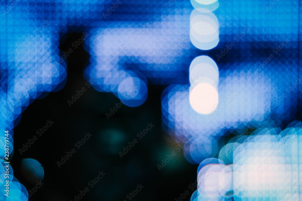 Blurred silhouette of the artist singer with a guitar on a scene. Abstract rock concert concept performance, blur background.