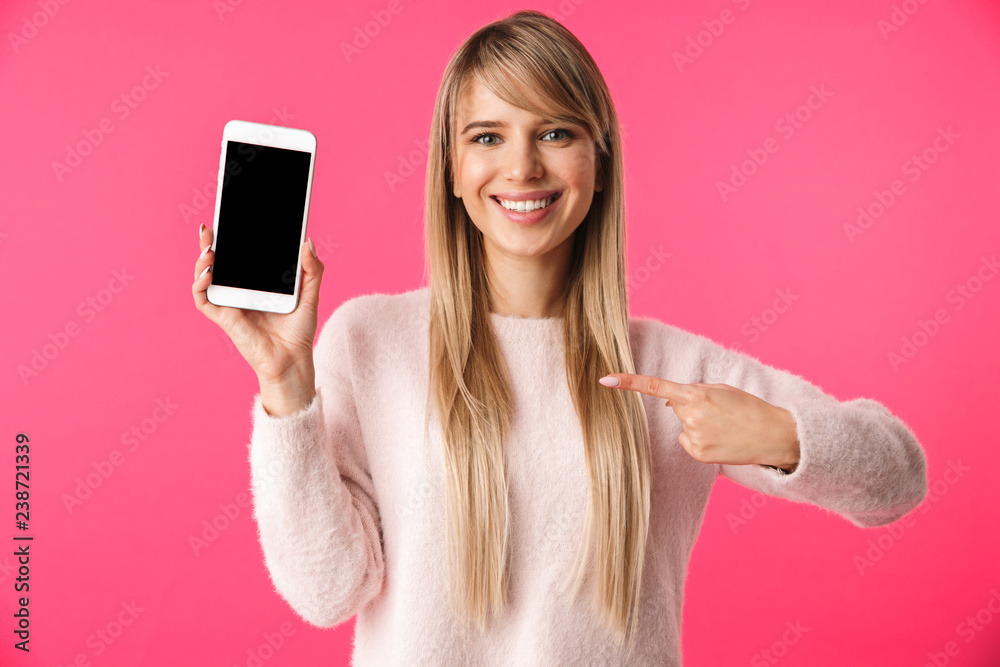 Cheerful young blonde woman wearing sweater Cheerful young blonde woman wearing sweater