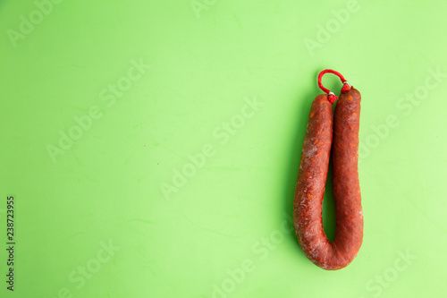 Food from spain, chorizo sausage slices or salami pepperoni, traditional spanish tapas, overhead.