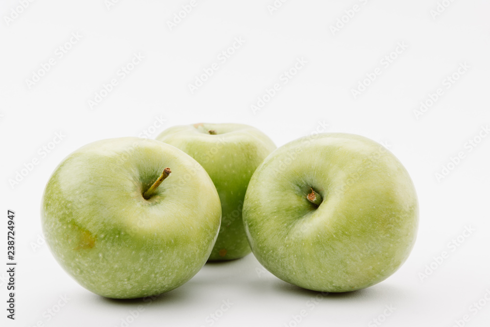 delicious large green apples on white background delicious large green apples on white background