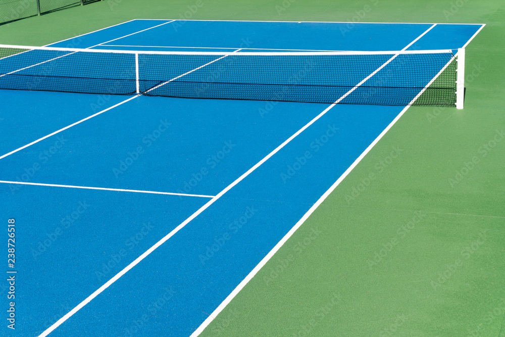 Blue Tennis court. Outdoor sunny day. Tennis concept. Copy space