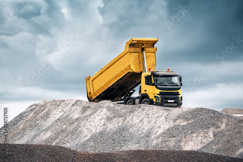 yellow truck with raised body