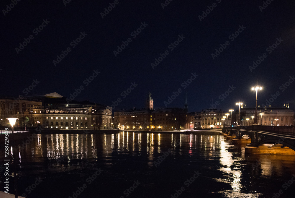 Evening view in Stockholm shilouettes of old town, parliament houses , bridges and lake Mälaren	