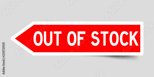 Arrow shape red color sticker in word out of stock on gray background