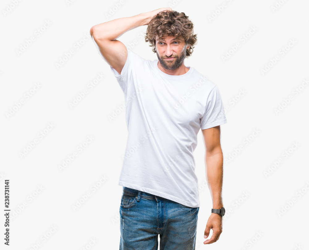 Fototapeta premium Handsome hispanic model man over isolated background confuse and wonder about question. Uncertain with doubt, thinking with hand on head. Pensive concept.