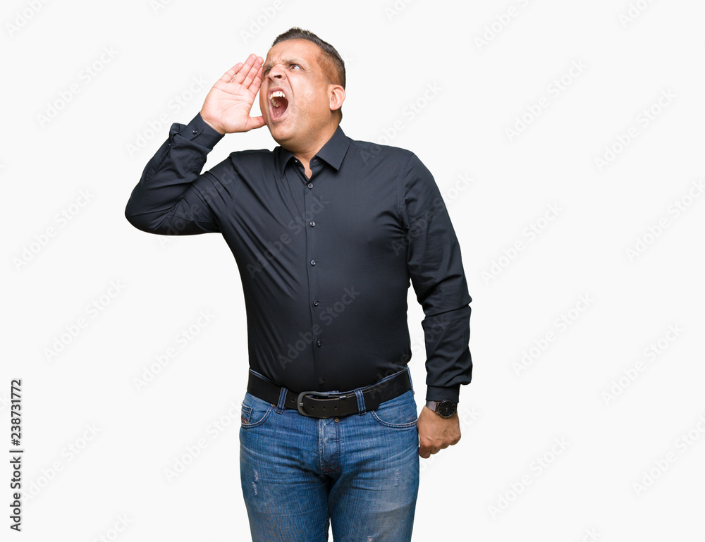 Handsome middle age arab business man over isolated background shouting and screaming loud to side with hand on mouth. Communication concept. Handsome middle age arab business man over isolated background shouting and screaming loud to side with hand on mouth. Communication concept.