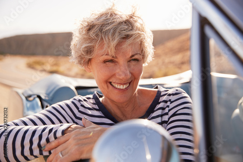 Senior woman in front passenger seat of open car, close up #238732132