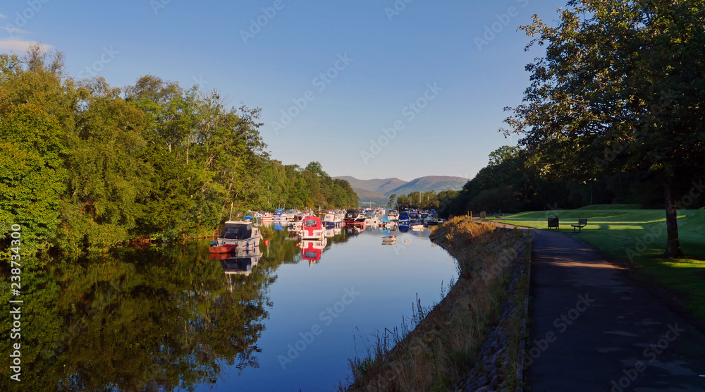 Balloch, Scotland / United Kingdom - August 2014: Boats anchored at River Leven nearby Loch Lomond