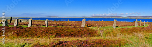 The Ring of Brodgar with Loch of Harray in the background at Mainland, Orkney Islands, Scotland, UK photo
