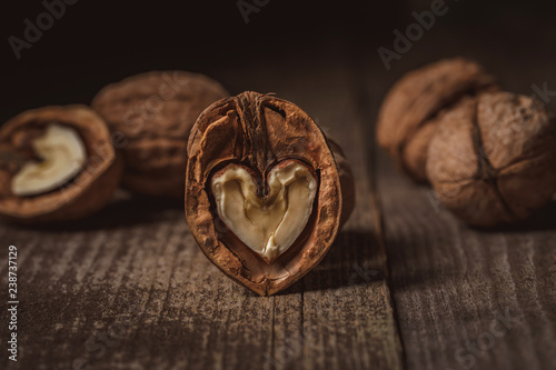 close up view of natural walnuts on wooden tabletop