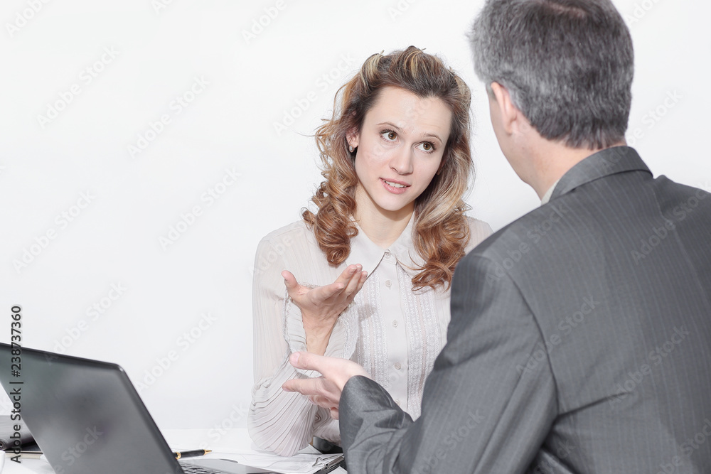 business colleagues discussing problems, at their work Desk. business colleagues discussing problems, at their work Desk.