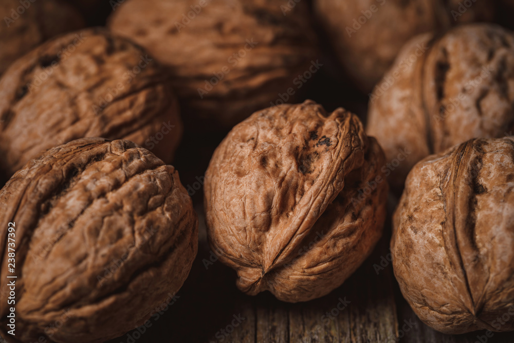 full frame of natural walnuts as backdrop full frame of natural walnuts as backdrop