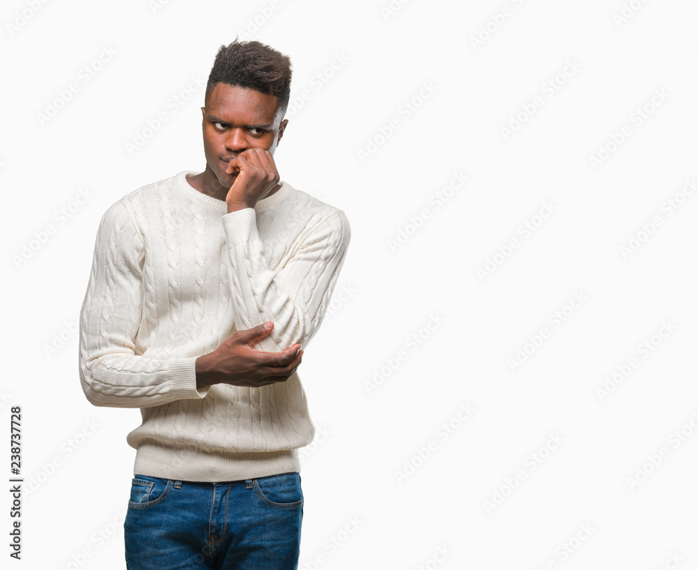Young african american man over isolated background looking stressed and nervous with hands on mouth biting nails. Anxiety problem.