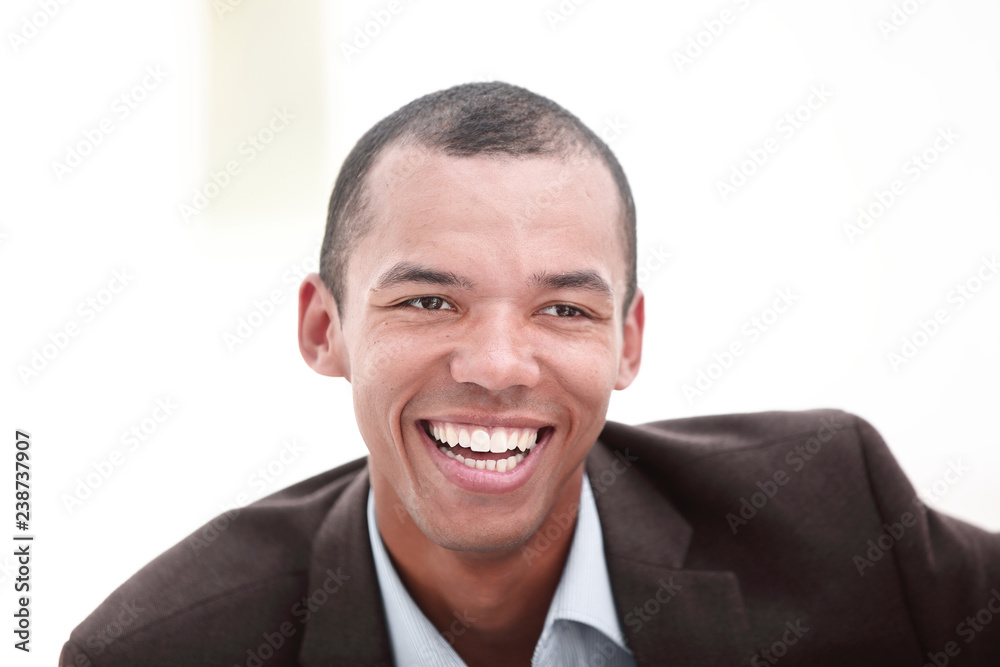 closeup.portrait of a young businessman on a light background closeup.portrait of a young businessman on a light background