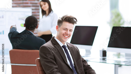 portrait of young employees sitting near the desktop