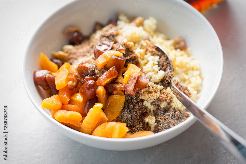Millet grain with dates, apricots, chia seeds and milk thistle Millet grain with dates, apricots, chia seeds and milk thistle