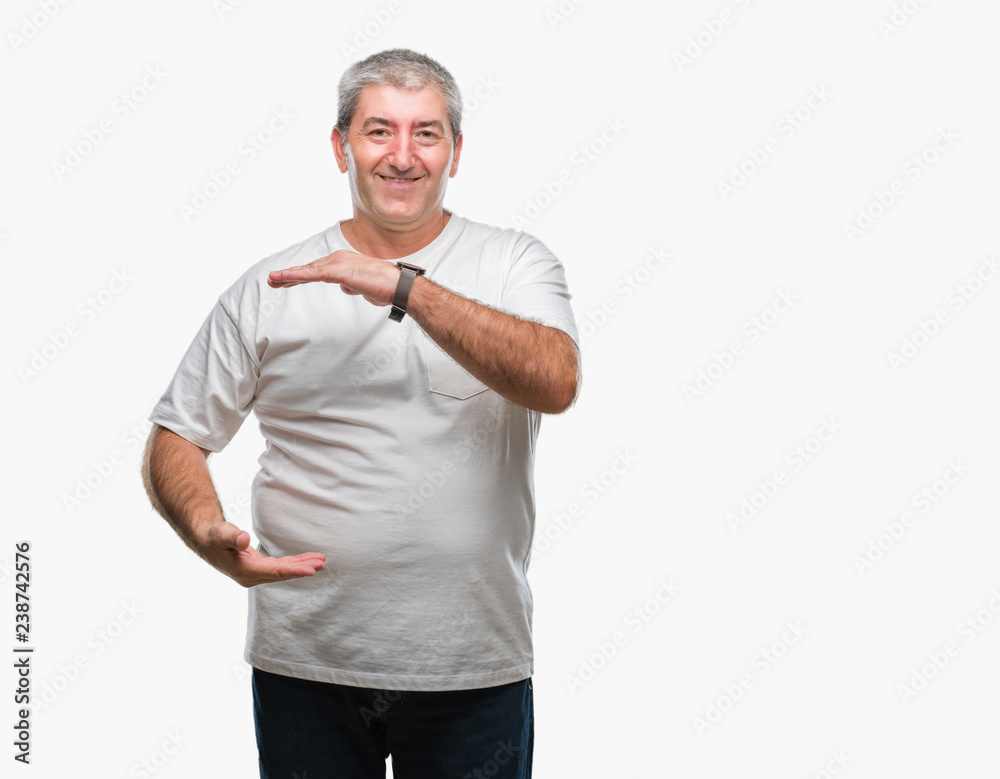 Handsome senior man over isolated background gesturing with hands showing big and large size sign, measure symbol. Smiling looking at the camera. Measuring concept. Handsome senior man over isolated background gesturing with hands showing big and large size sign, measure symbol. Smiling looking at the camera. Measuring concept.