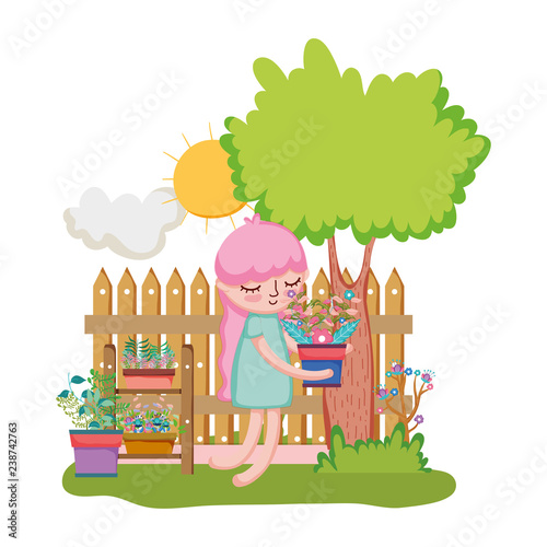little girl lifting houseplant with fence and tree