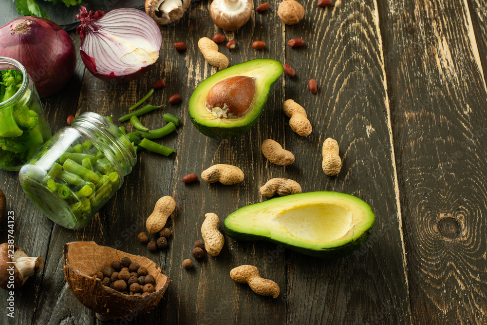 Vegan food, detox, avocado, fruit, green beans, broccoli, nuts and mushrooms. Diet and healthy food, vitamins and sports. Flat-lay, Clean and healthy food on a wooden background. Vegan food, detox, avocado, fruit, green beans, broccoli, nuts and mushrooms. Diet and healthy food, vitamins and sports. Flat-lay, Clean and healthy food on a wooden background.