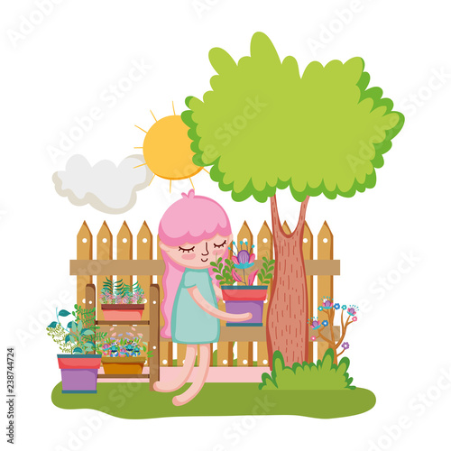 little girl lifting houseplant with fence and tree