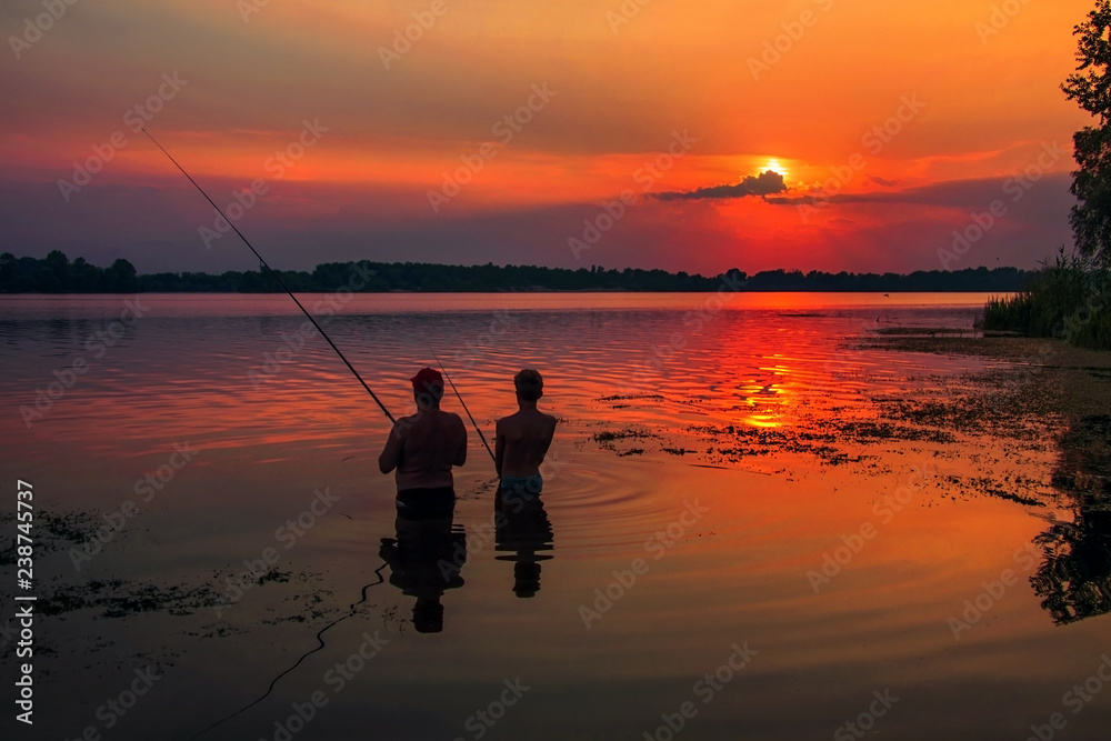 Young and old fisher. Dnieper river, Kyiv.