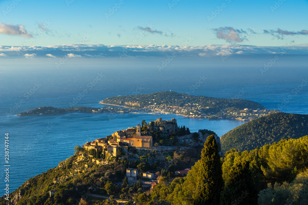 Eze (Èze) Village, the Mediterranean Sea and Saint-Jean-Cap-Ferrat at sunrise. Alpes-Maritimes, French Riviera, France