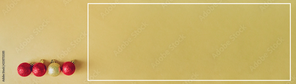 web banner design for elegant holiday party event and celebration concept for shimmer and shine gold and red ball decorate on gold glitter background web banner design for elegant holiday party event and celebration concept for shimmer and shine gold and red ball decorate on gold glitter background