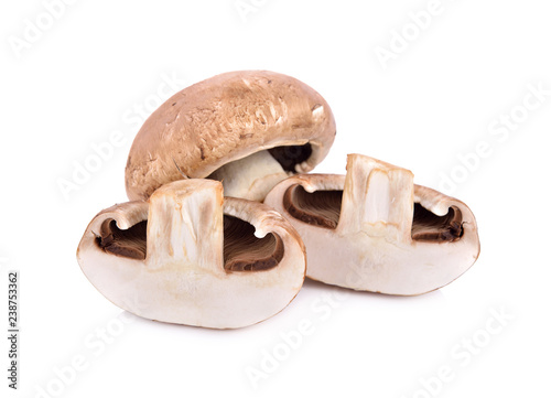 whole and half cut fresh champignon mushrooms on white background