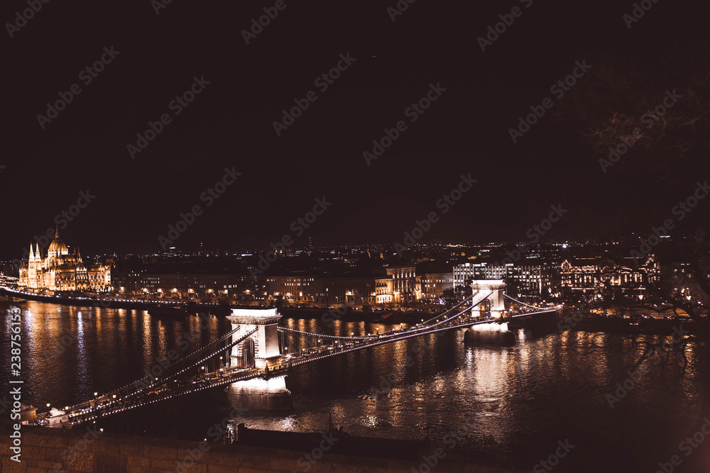 View of Chain Bridge and parliament illuminated at night, Budapest, Hungary
