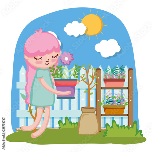 little girl lifting houseplant with fence and shelf