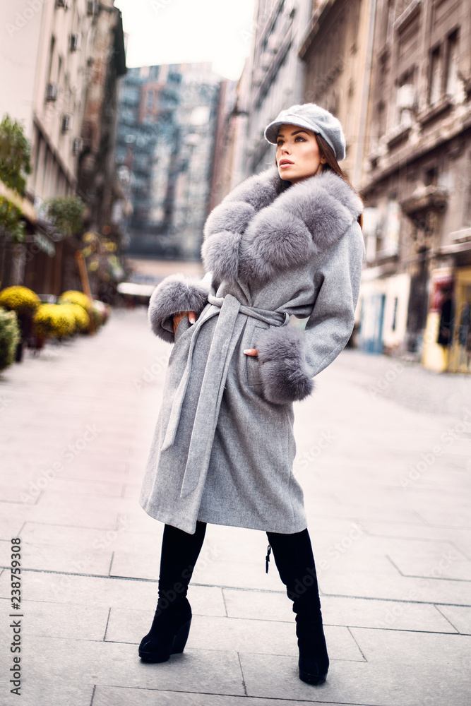 Gorgeous woman posing in luxurious fur coat