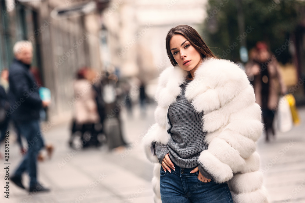 Gorgeous woman posing in luxurious fur coat Gorgeous woman posing in luxurious fur coat