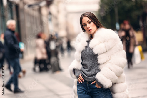 Gorgeous woman posing in luxurious fur coat photo