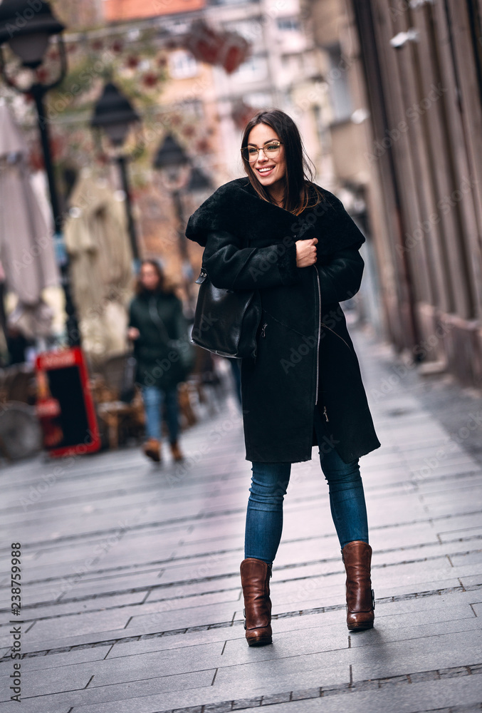Fototapeta premium Gorgeous woman posing in luxurious fur coat