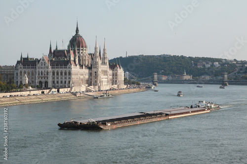 The view of the Budapest Parliament and the barge on Danube River