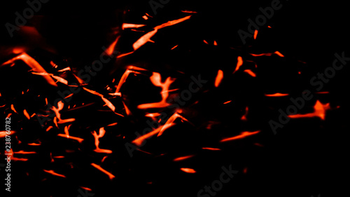 Fire particles isolated on background texture overlays . Film effect.