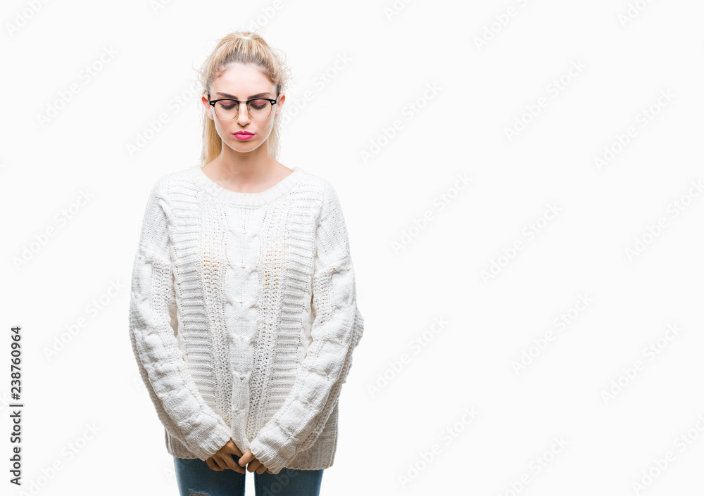 Young beautiful blonde woman wearing glasses over isolated background depressed and worry for distress, crying angry and afraid. Sad expression.