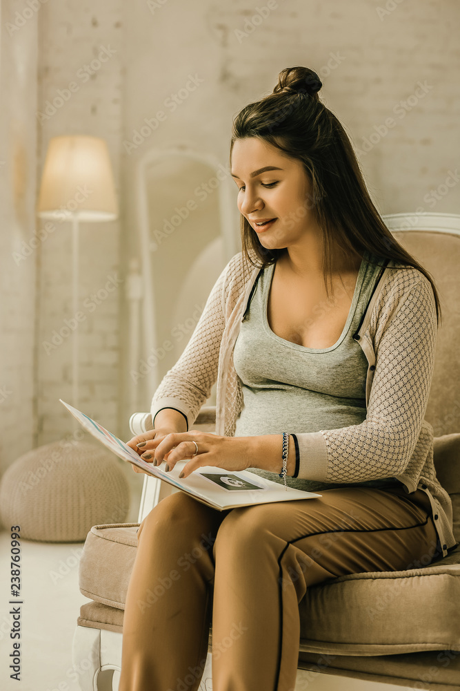 Pregnant woman checking her medical tests results