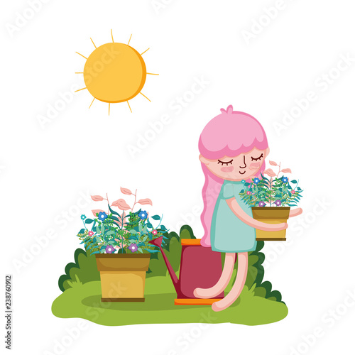 girl lifting houseplant with sprinkler in the garden