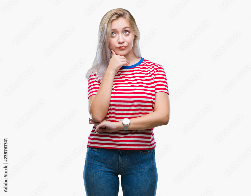 Young blonde woman over isolated background with hand on chin thinking about question, pensive expression. Smiling with thoughtful face. Doubt concept. Young blonde woman over isolated background with hand on chin thinking about question, pensive expression. Smiling with thoughtful face. Doubt concept.