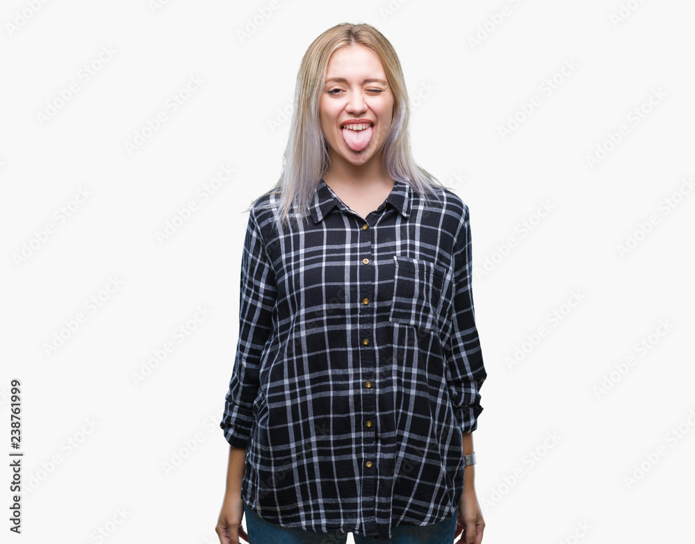 Fototapeta premium Young blonde woman over isolated background sticking tongue out happy with funny expression. Emotion concept.